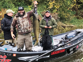 Jan Hrdlicka (front center) holds a Chinook salmon on the Oswego River. Looking on are Olaf Jochmann, back left and Capt. Kevin Davis, right. Photos courtesy of Catch the Drift and Chasin' Tail Adventures guide services.